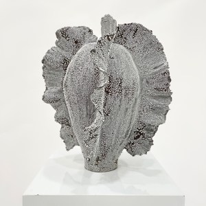 pottery piece, black vase with white textured glaze. Reminding of coral. Sculptural ceramics.